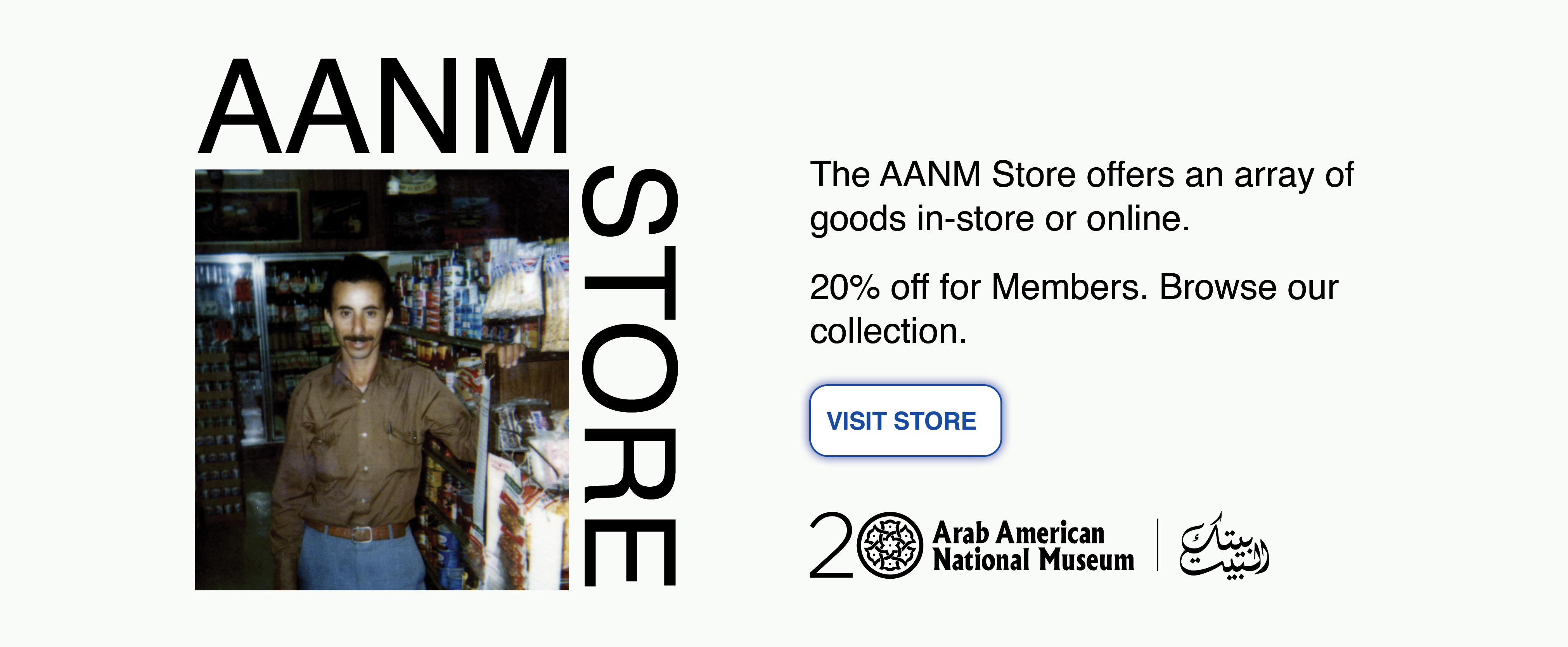 Arab American man standing in a grocery store aisle, surrounded by shelves stocked with canned goods and snacks.