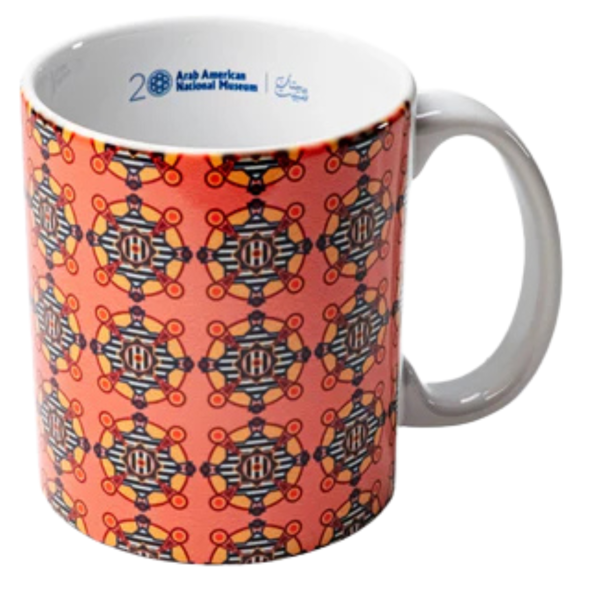Dahlia Elsayed x AANM 20th Anniversary ceramic mug featuring a repeating abstract geometric pattern in orange, black, yellow, and white.