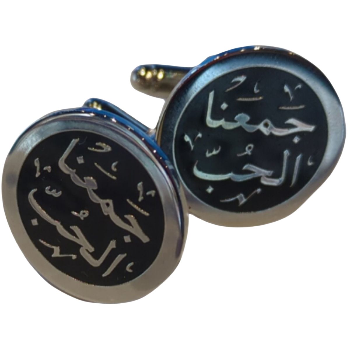 A poetic finishing touch—these cufflinks say 'Love brought us together' in delicate Arabic script. Round silver cufflinks with Arabic calligraphy reading 'Jama3na el hob' meaning 'Love Brought Us Together.'