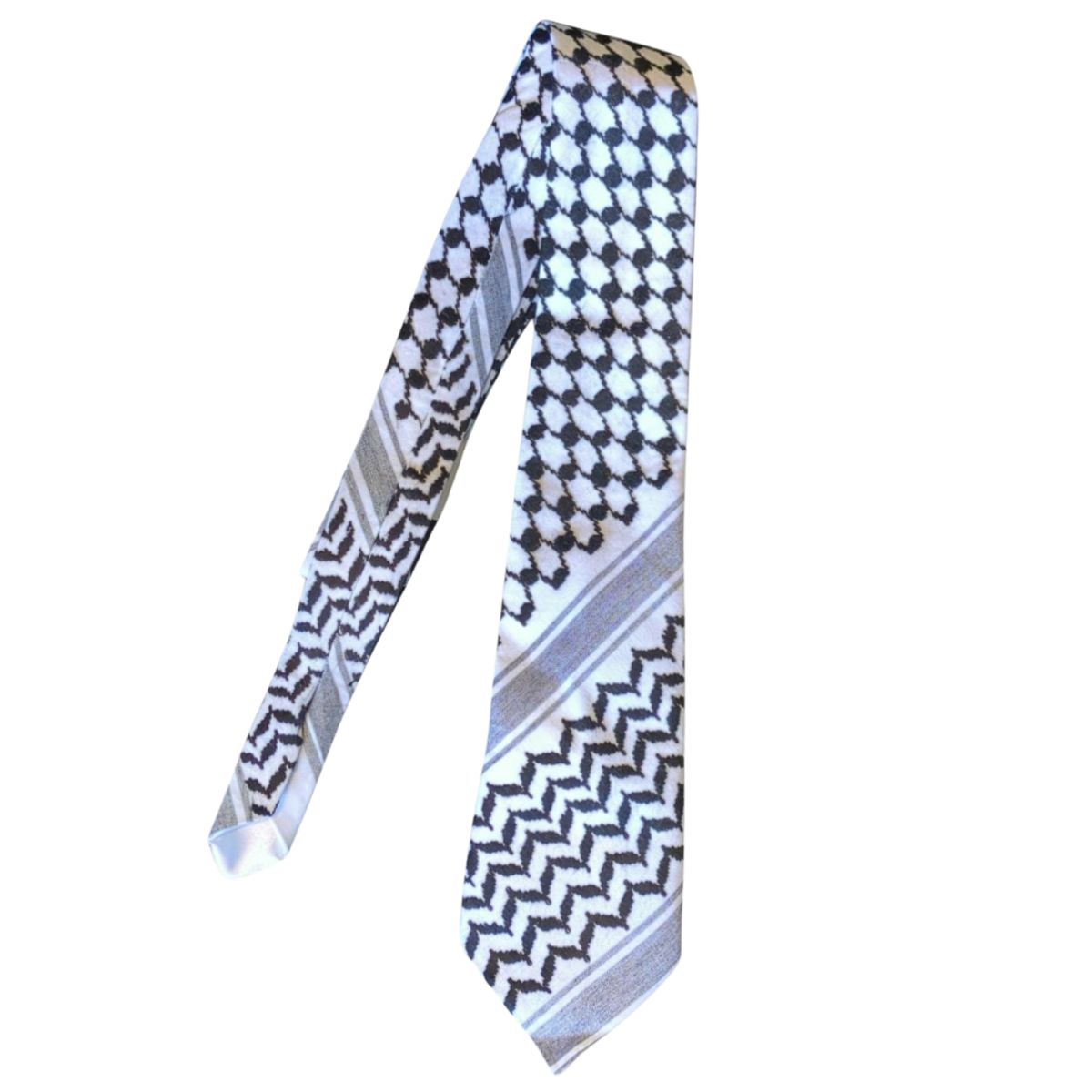 A keffiyeh tie that brings cultural heritage into everyday style. Keffiyeh-pattern necktie handmade from a traditional black-and-white scarf.